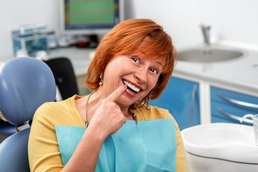 Woman with dental implants from Reno