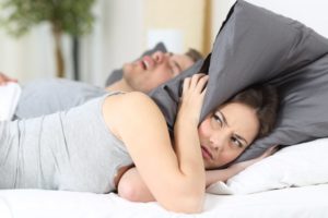 wife annoyed by husband's snoring