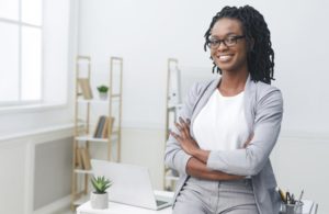 person sitting on their desk at work