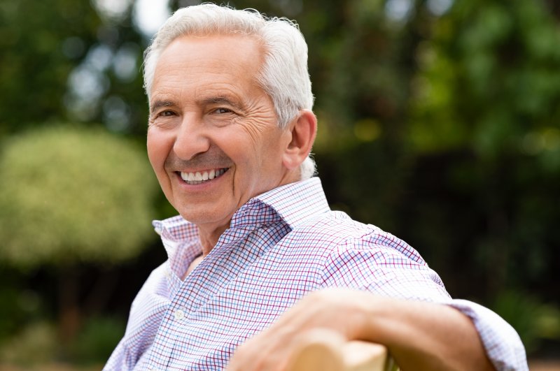 Senior man smiling with dental implants