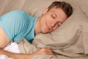 man resting peacefully and smiling